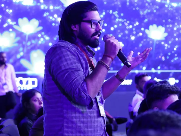 Abhishek speaking with a microphone at Shiprocket SHIVIR 2026