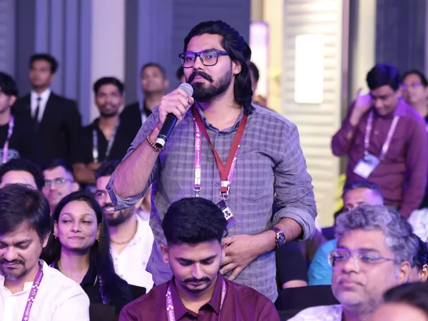 Abhishek standing with a microphone among delegates at Shiprocket SHIVIR 2026